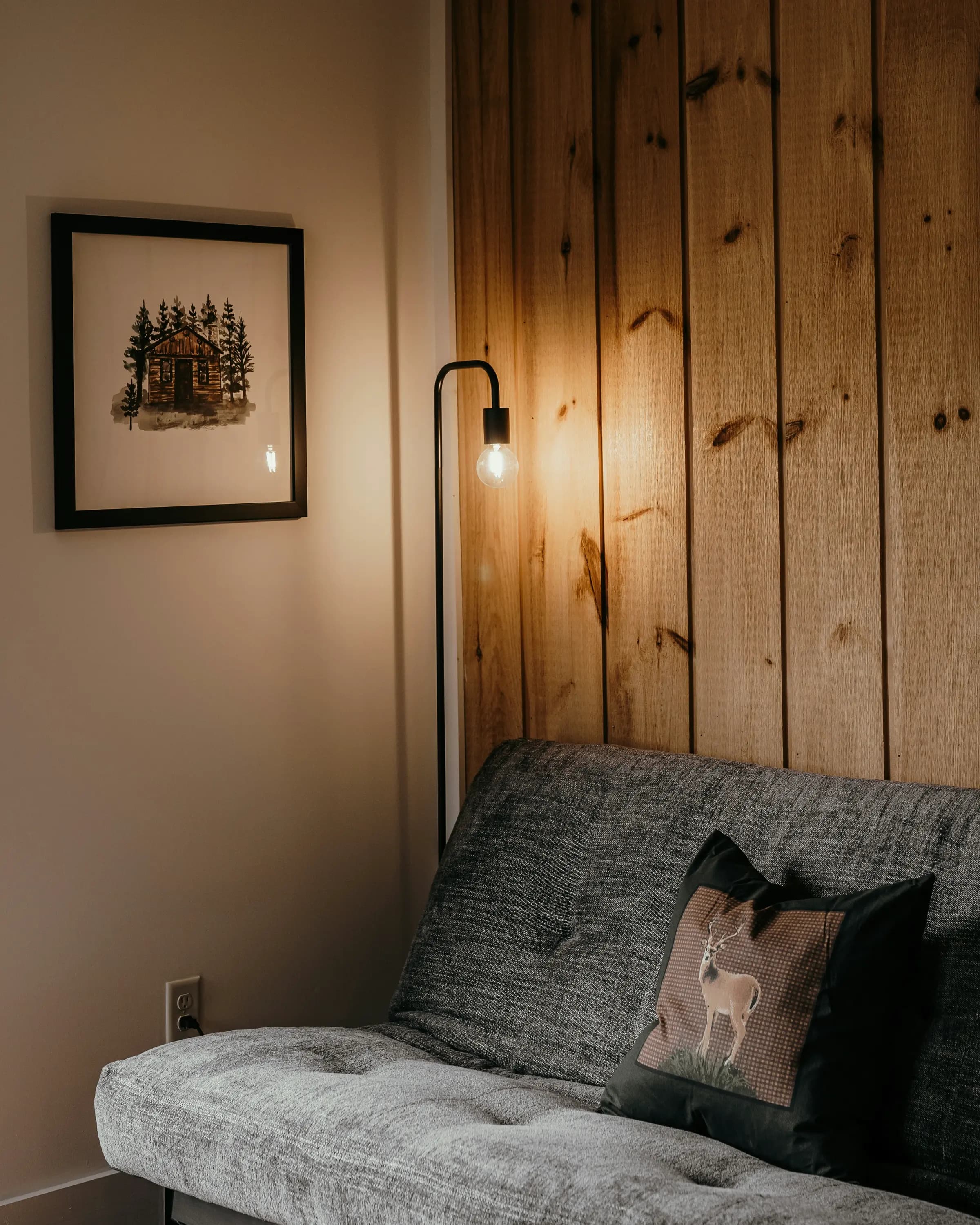 A calm, well-lit shared living area with comfortable seating — residential support environment